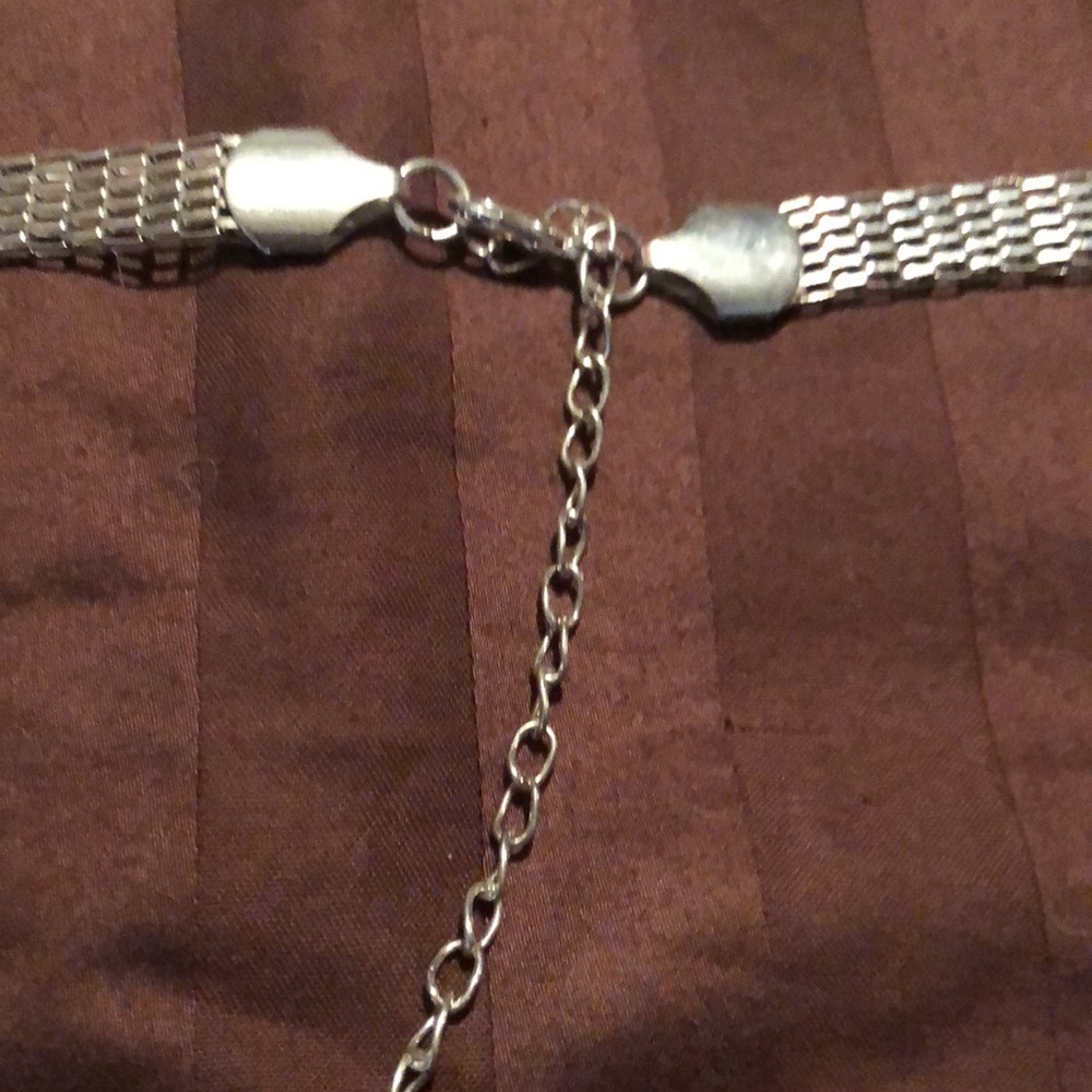 Jennifer Lopez. Silver tone necklace, possibly a belt. - Picture 4 of 5